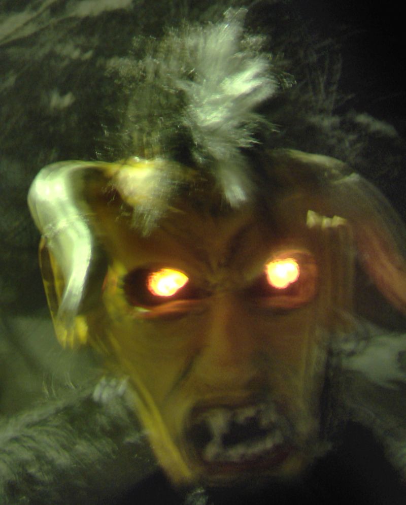 Double exposed image of a German Krampus creature.  Taken in Austria, December 2010.