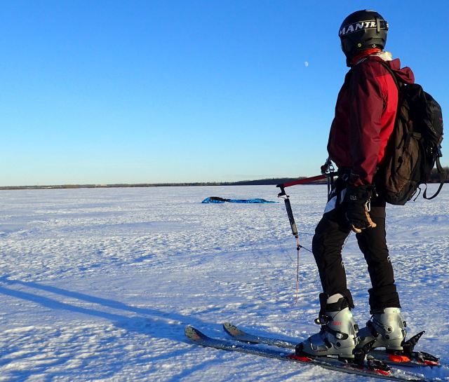 Para-glider-skier with his downed kite on Big Lake.