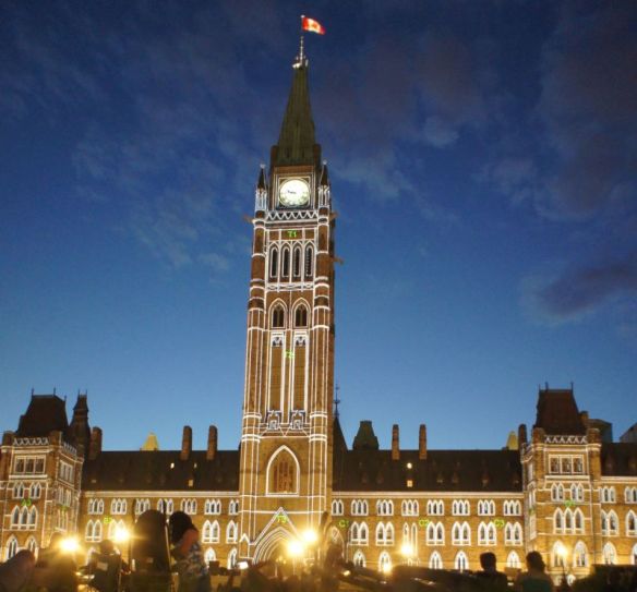 Canada's Parliament illuminated as part of an evening show on its grounds, 2015-07-10, P. Potter.
